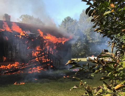 Heavy fire could be seen coming from the back of the house.