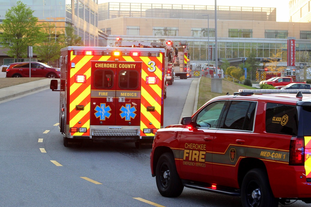 Cherokee County Fire Department vehicles make a lap around Northside Cherokee Hospital. Cherokee County Fire Department vehicles make a lap around Northside Cherokee Hospital.
