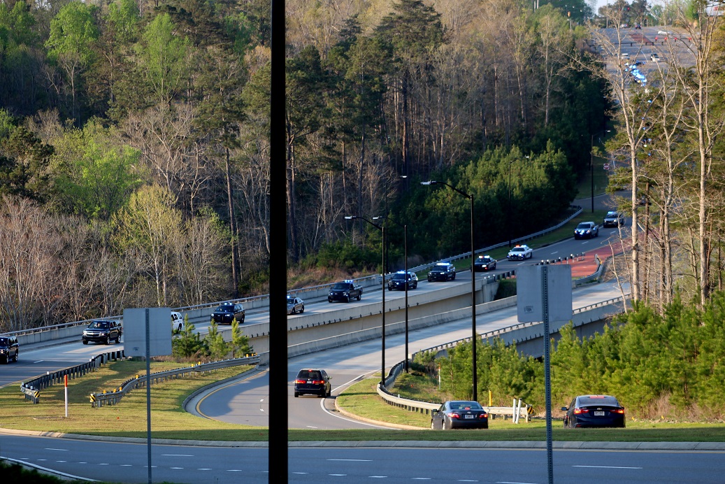Public safety vehicles make their way down Northside Cherokee Boulevard. Public safety vehicles make their way down Northside Cherokee Boulevard.