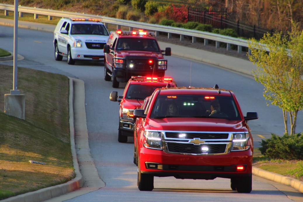 Cherokee County Fire Chief, Tim Prather, leads several of the vehicles along the parade route. Cherokee County Fire Chief, Tim Prather, leads several of the vehicles along the parade route.