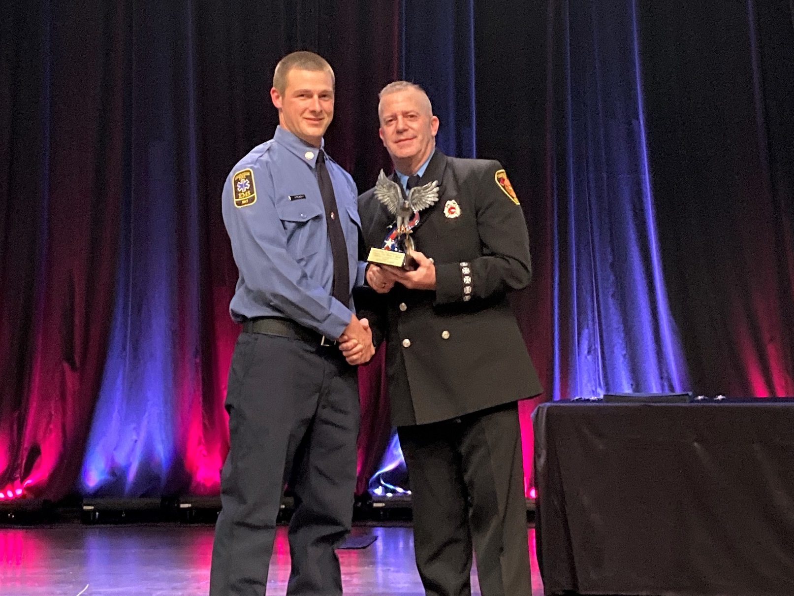 Jim Laughlin (right) presents the W. Clark Waters' Jr. Honor Graduate Award to Seth Grummer.