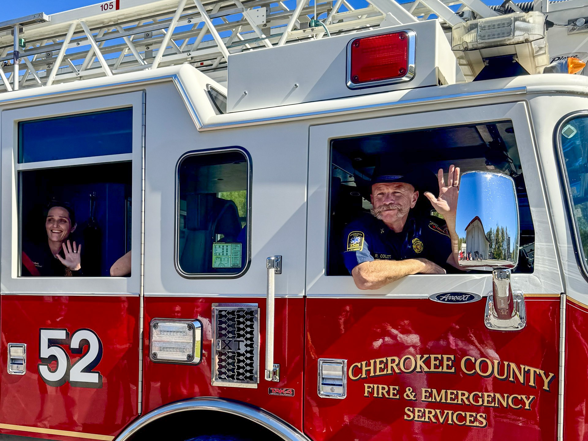 Chief Collett takes his final ride home in a ladder truck.