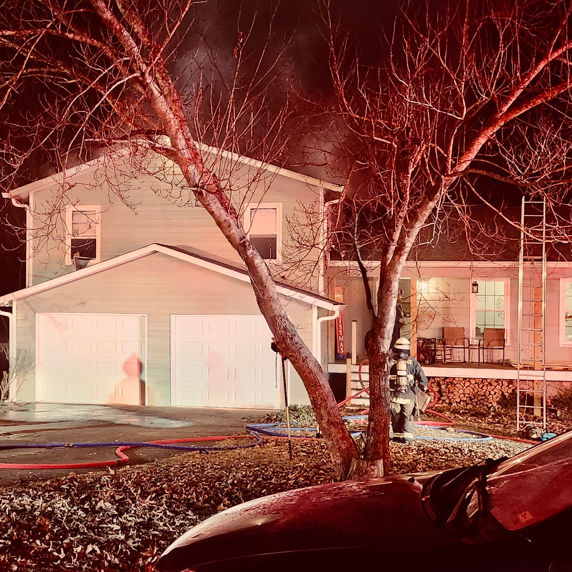 Firefighters work at the scene of a structure fire