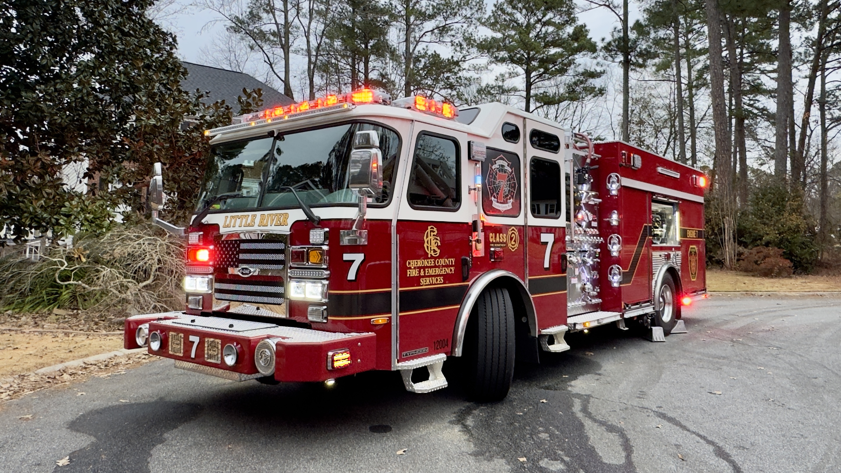 Engine 7 positioned in front of house fire. 