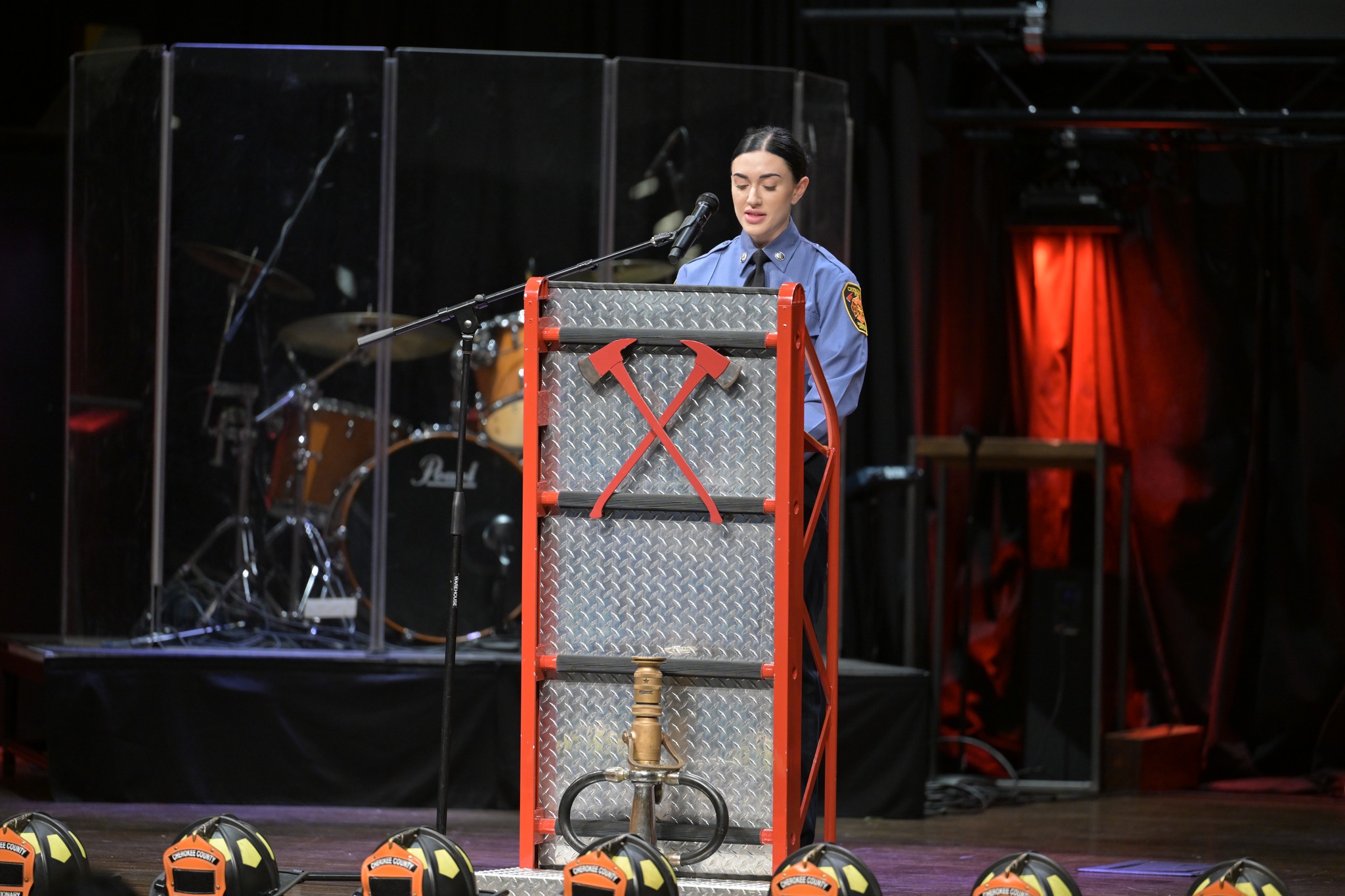 Firefighter Little addresses the audience. 
