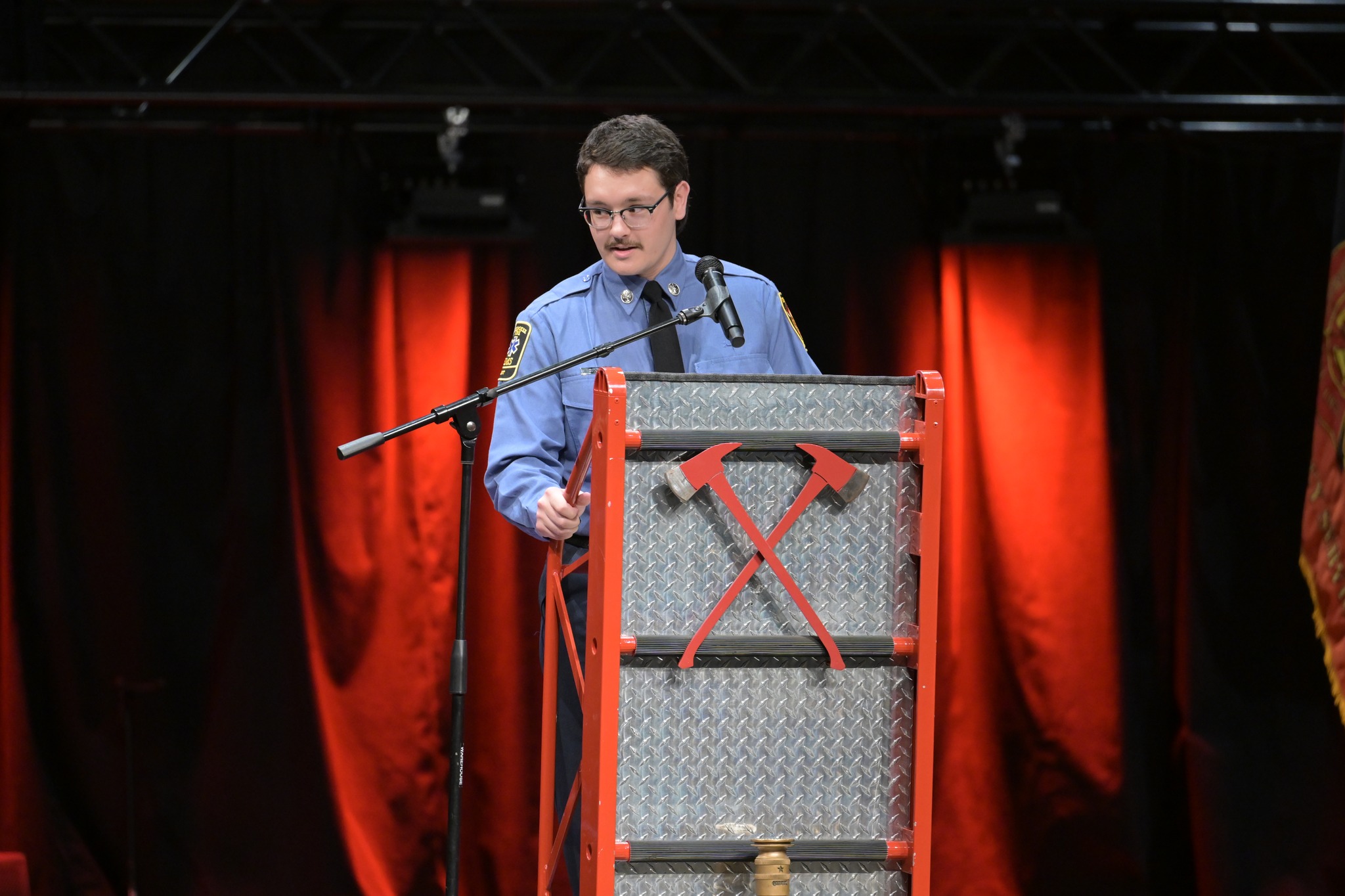 Firefighter Luca addresses the audience. 